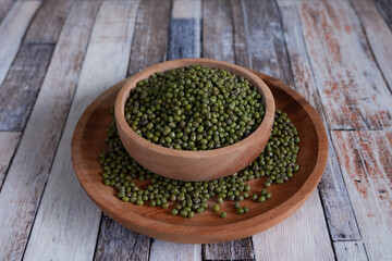 Mung bean in wooden bowl and plate.