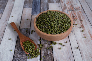 Mung bean in wooden bowl and plate.