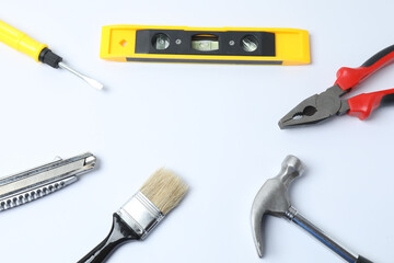 Set of tools for repair. Hammer pliers screwdriver angle pliers adjustable wrench. Many tools 