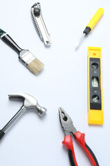 Set of tools for repair. Hammer pliers screwdriver angle pliers adjustable wrench. Many tools	