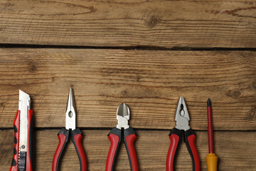 Set of tools for repair. Hammer pliers screwdriver angle pliers adjustable wrench. Many tools 