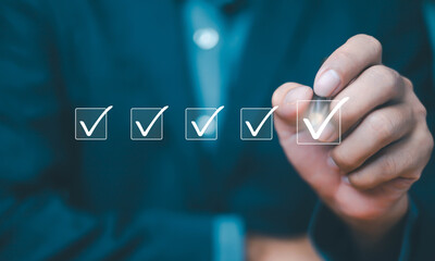 Businessman checklist concept as clipboard document checklist form on the virtual screen Use your...