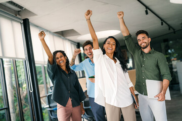 Success group of multiethnic entrepreneurs and business people achieving goals in corporate office