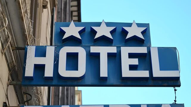 Hotel sign at the hotel entrance. Three stars hotel.