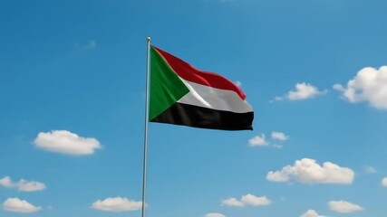 Sudan silk flag waving against a clear blue sky during a bright day. Sudanese flag - the national symbol of Sudan, Sudanese flag at sunrise