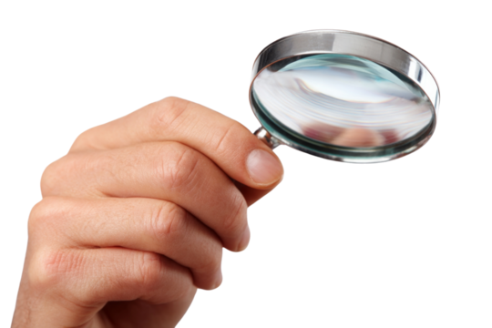 A hand holding a magnifying glass
