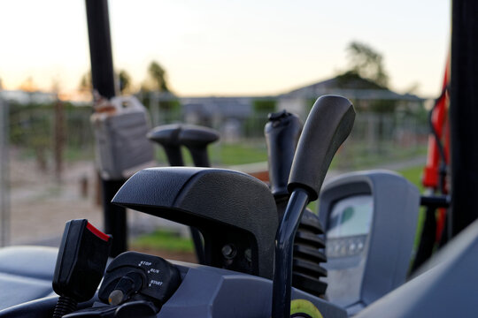 Gear levers and equipment on inside of mini excavator digger