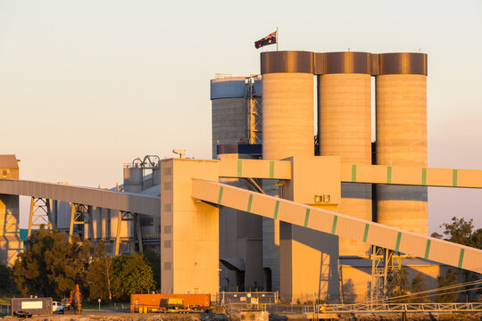 Tall grain silos and conveyor chutes at the Port of Brisbane