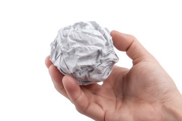 Hand holding crumpled paper isolated on white background