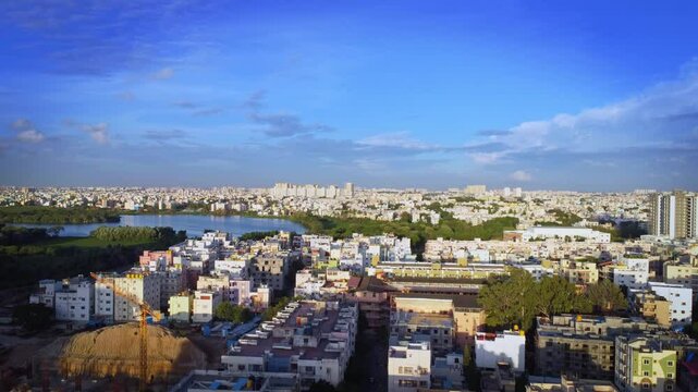 Aerial shot of BTM lake and city skyscrappers in background in Bangalore, Karnataka, India	