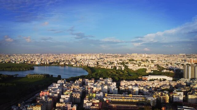 Aerial shot of BTM lake and city skyscrappers in background in Bangalore, Karnataka, India	