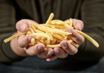 french fries in human hands