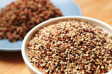 Bowl of the Uncooked Tricolor Quinoa with a Plate of Boiled Quinoa in the Backdrop, a Healthy Seeds that Also Cultivated in the Highlands of Northern Thailand