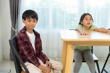 Children Engaged in Playful Discussion at Home