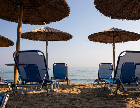 Beach with sun beds and umbrellas near the sea