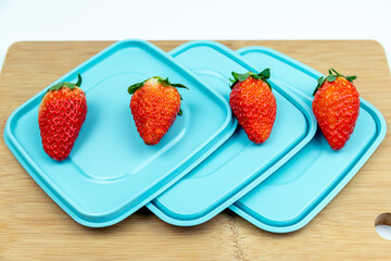 Fresh strawberries on the lid of the lunch box