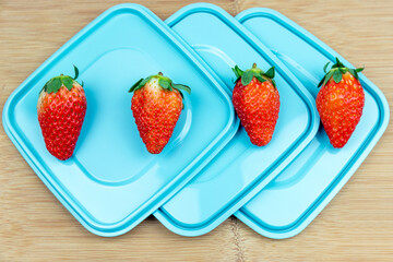 Fresh strawberries on the lid of the lunch box
