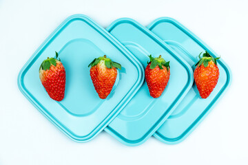Fresh strawberries on the lid of the lunch box