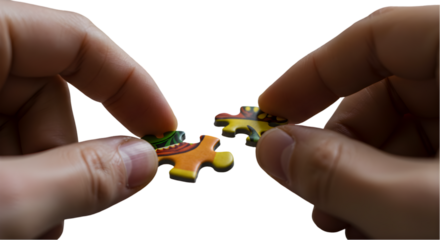 Hands Assembling Puzzle Pieces in Close Up on Transparent Background Photo