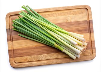 Fresh lemongrass stalks arranged beautifully on a wooden cutting board surface