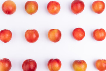 Neatly arranged fresh red plums