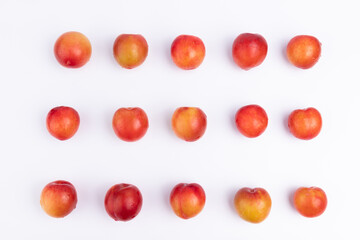 Neatly arranged fresh red plums