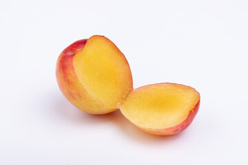Fresh red plums cut in half