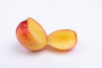 Fresh red plums cut in half