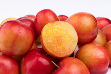 Fresh red plums cut in half