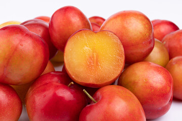 Fresh red plums cut in half