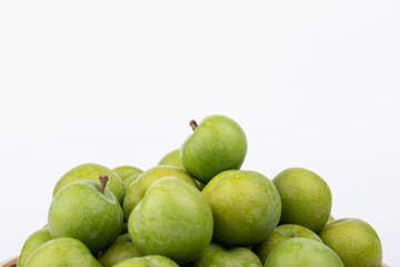 Fresh plums on a white background