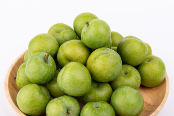 Fresh plums on a white background