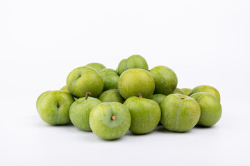 Fresh plums on a white background