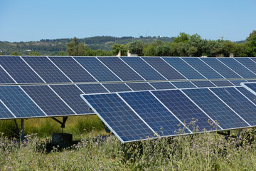 Rows of solar panels harness the sun’s power in the rural Portuguese countryside, highlighting...