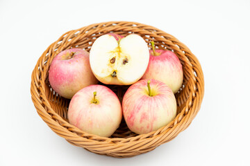 Fresh apples in the fruit plate on the wood-grain table