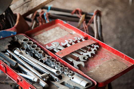Tool box lying open in a farm shed