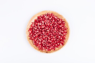 The pomegranate pulp pieces on the plate