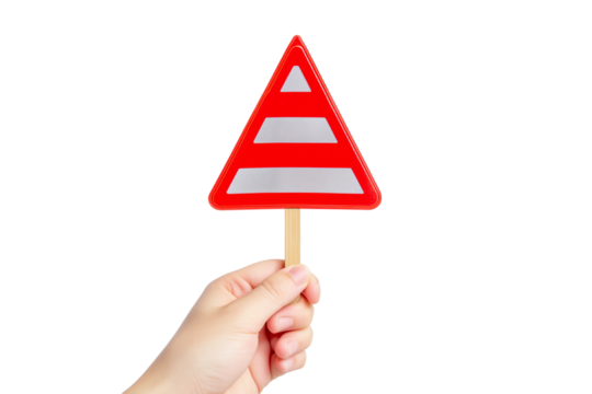 hand holding red triangular warning sign isolated on white background