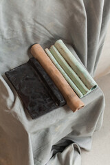 Minimalist still life of handmade ceramic decor in earthy tones. Unique pottery pieces for interior styling: vases, lamps, mirror frames, and home accessories with natural textures