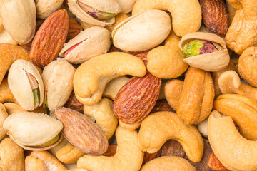 Close-up of roasted nuts, including cashews, almonds, and pistachios.