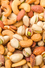 Close-up of roasted nuts, including cashews, almonds, and pistachios.
