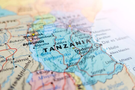 Map of Tanzania with flare from top right corner. Selective focus on label, close-up view