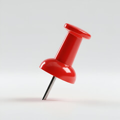 Red push pin angled on plain background. Isolated office supply with no people or objects. Generic office supply for business use. generic office.
