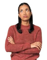 Zelfklevend Fotobehang Young Filipina woman tired of a repetitive task. © Asier
