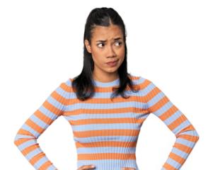 Young Filipina woman confused, feels doubtful and unsure.