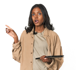 Young Indian woman with digital tablet pointing to the side