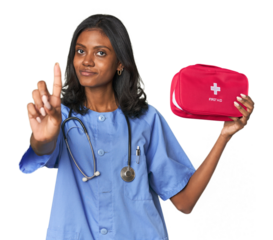 Young Indian nurse with first aid kit showing number one with finger.