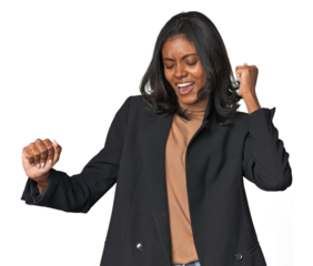 Young Indian woman in business suit dancing and having fun.