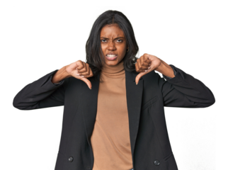 Young Indian woman in business suit showing thumb down and expressing dislike.