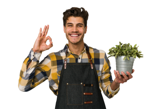 Young caucasian gardener man isolated on white background cheerful and confident showing ok gesture.